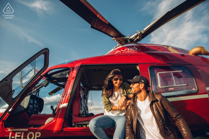 Photo by: <a href="https://www.wpja.com/photos/diamond-award-top-wedding-engagement-photographer/2434886">Enrico Celotto - Mussolente Vicenza Vicenza pre-wedding portraits of a Couple sitting on red helicopter