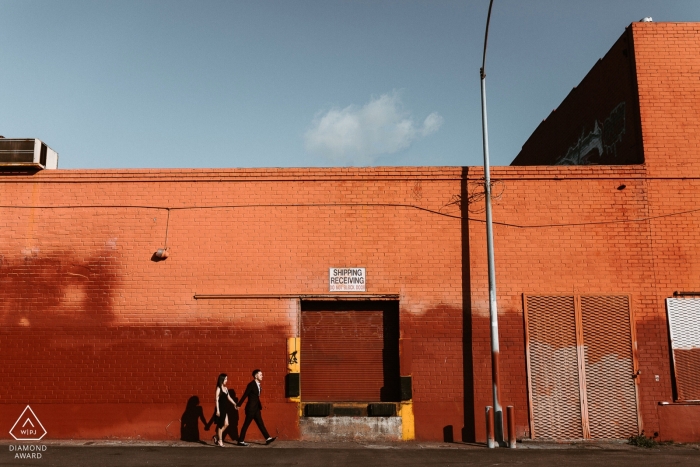 Downtown Los Angeles engagement portraits in the afternoon sun with industrial buildings - City and color 