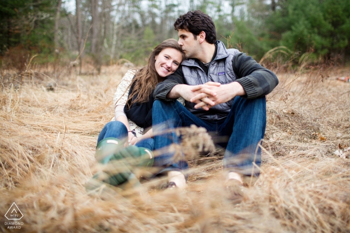 Photo by: <a href="https://www.wpja.com/photos/diamond-award-top-wedding-engagement-photographer/2452176">Kevin Trimmer - Providence Rhode Island Connecticut Couple sitting in grass during their engagement portrait session