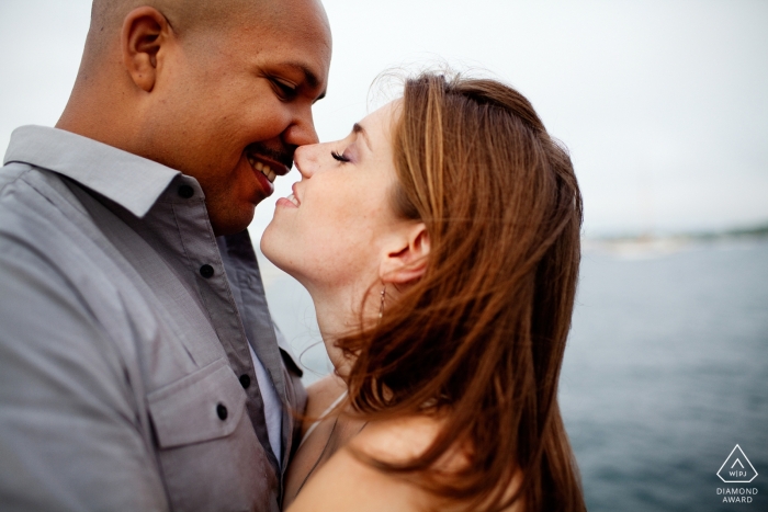 Photo by: <a href="https://www.wpja.com/photos/diamond-award-top-wedding-engagement-photographer/2452206">Kevin Trimmer - Providence Rhode Island Newport, Rhode Island engagement portrait session - intimate Couple near ocean