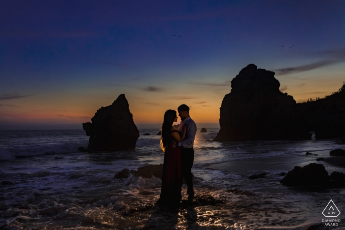 Photo by: <a href="https://www.wpja.com/photos/diamond-award-top-wedding-engagement-photographer/2450161">Tanya Parada - Los Angeles California Malibu, California Beach Engagement Photos at sunset in the water