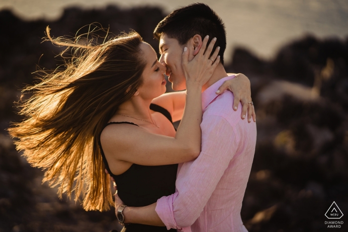 Photo by: <a href="https://www.wpja.com/photos/diamond-award-top-wedding-engagement-photographer/2434746">Nicole Chan - Quincy Massachusetts Destination wedding photography and engagement portraits | Maui, Hawaii engagement session in the wind at the beach