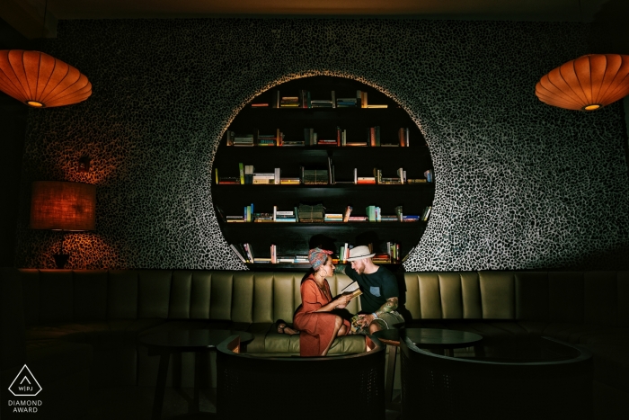 Playa del Carmen, Mexico engagement portrait - bride and groom reading a book 