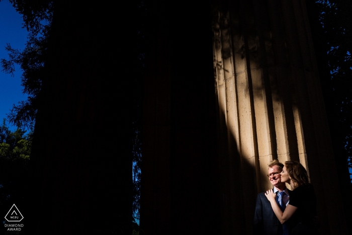 Photo by: <a href="https://www.wpja.com/photos/diamond-award-top-wedding-engagement-photographer/2452546">Chris Shum - Sunnyvale California A small shaft of sunlight illuminates this couple as they embrace for their San Francisco engagement portraits