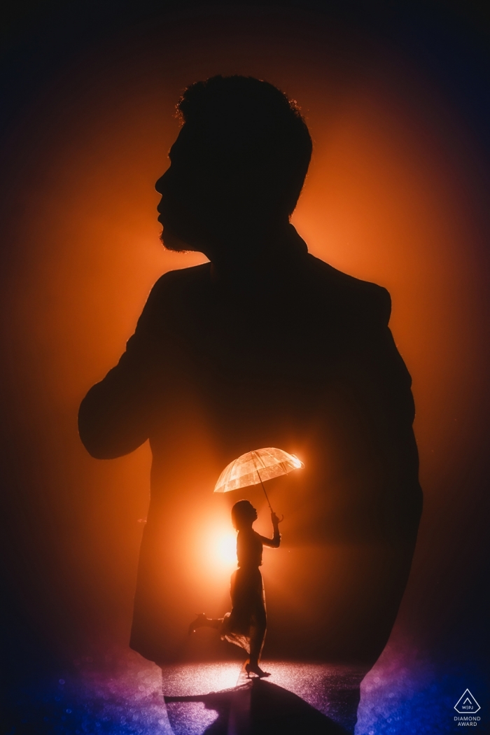 Photo by: <a href="https://www.wpja.com/photos/diamond-award-top-wedding-engagement-photographer/2457006">Henry Xu - Fuzhou Engagement photo using light and shadow to make it appear as though the bride is dancing in the groom's heart in Kuliang Mount.