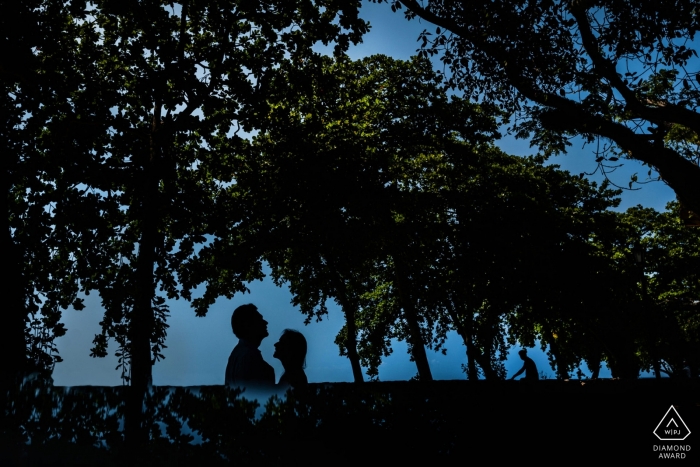 Engagement PhotoShoot with pre wedding couple standing close under trees Galle Fort, Galle, Sri Lanka Engagement PhotoShoot with pre wedding couple