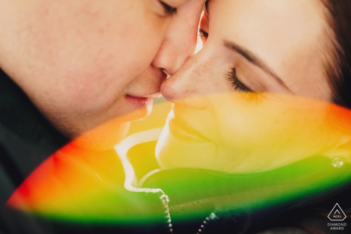 Photo by: <a href="https://www.wpja.com/photos/diamond-award-top-wedding-engagement-photographer/2459596">Ashley Davenport - Castle Dongington Derbyshire London Pre-Wedding Engagement Photography - Colour image of close up with rainbow lens flare