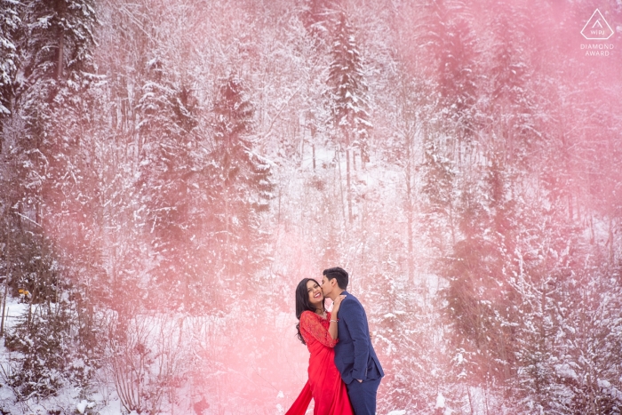 Photo by: <a href="https://www.wpja.com/photos/diamond-award-top-wedding-engagement-photographer/2461331">Sheraz Khwaja - Ilfod Essex Interlaken, Switzerland pink smoke grenade engagement winter portrait
