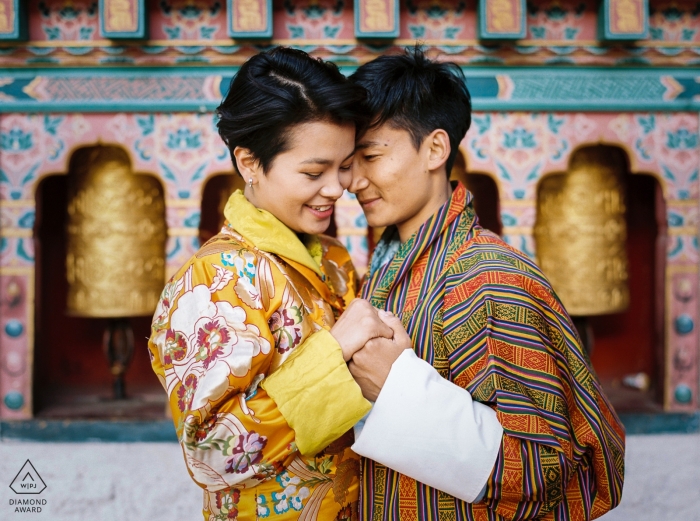 Engagement photo of a couple standing in front of a temple in Thimphu, Bhutan. Engagement photo of a couple standing in front of a temple in Thimphu, Bhutan.