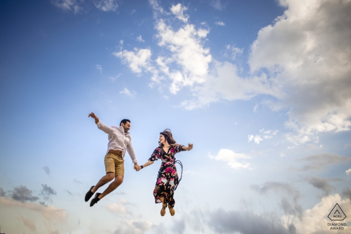 Photo by: <a href="https://www.wpja.com/photos/diamond-award-top-wedding-engagement-photographer/2469366">Emre Nesli - İstanbul Istanbul Istanbul engagement shoot captured this couple jumping into the clouds