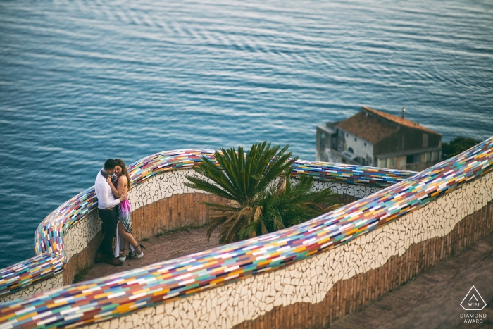 Photo by: <a href="https://www.wpja.com/photos/diamond-award-top-wedding-engagement-photographer/2472406">Paolo Ferrera - Alvito Frosinone Couple kisses on a rainbow tiled walkway in this Vietri Sul Mare - Salerno engagement photo session