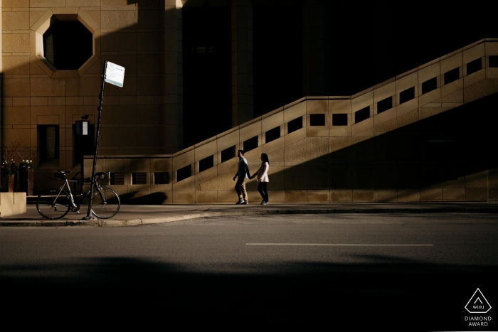 Photo by: <a href="https://www.wpja.com/photos/diamond-award-top-wedding-engagement-photographer/2475136">Eric Corbacho - São Caetano do Sul São Paulo Chicago Engagement Portrait Photographer: "I asked the couple to walk down the street. and the light and shadow accentuated the two of them."