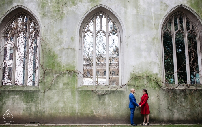 Photo by: <a href="https://www.wpja.com/photos/diamond-award-top-wedding-engagement-photographer/2475646">Gyula Lovaszi - Ealing London St Dunstan Engagement Portrait in the East church garden - Couple posing by the wall