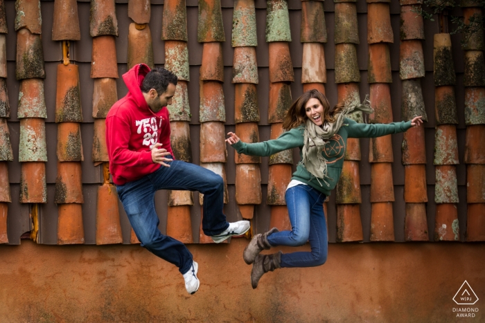 Photo by: <a href="https://www.wpja.com/photos/diamond-award-top-wedding-engagement-photographer/2475706">Miguel Onieva - Madrid Madrid Jumping engaged couple portrait in a front roof at Toledo, Castilla-La Mancha (Spain)