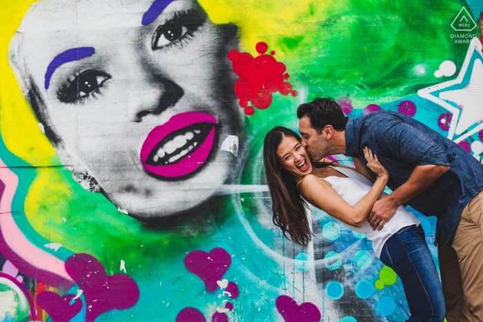 Asbury Park New Jersey Art Mural Engagement Portrait. Photographer: "Loved her energy so we used it for an awesome photo."