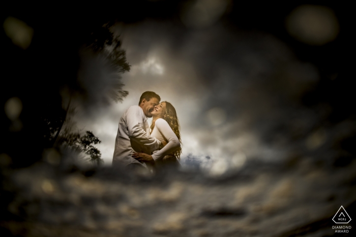 Photo by: <a href="https://www.wpja.com/photos/diamond-award-top-wedding-engagement-photographer/2479971">Pasquale Minniti - Reggio Calabria Scilla Enagaged Couple Portrait | reflections in a pool of water