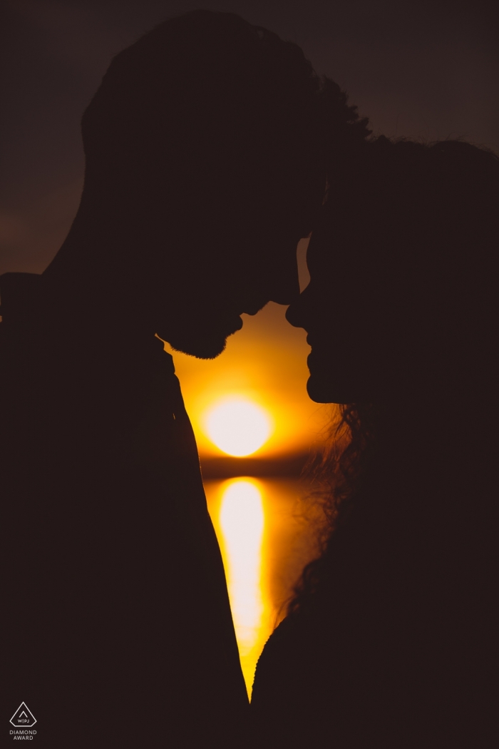 Photo by: <a href="https://www.wpja.com/photos/diamond-award-top-wedding-engagement-photographer/2497146">Massimiliano Esposito - Orvieto Terni Silhoutted couple share a moment during their pre-wedding session in Bolsena Italy