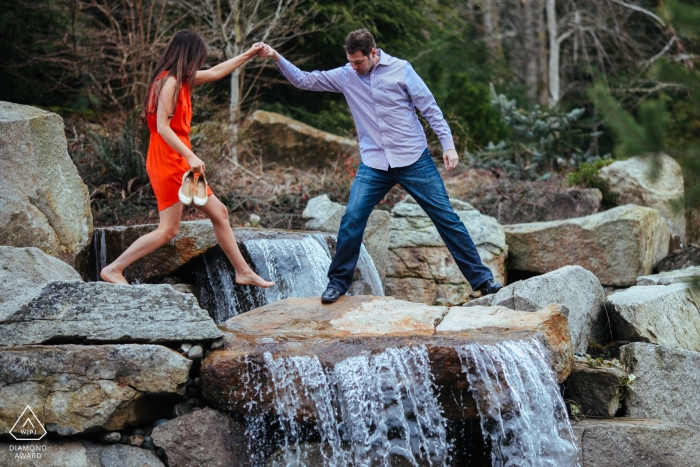 Photo by: <a href="https://www.wpja.com/photos/diamond-award-top-wedding-engagement-photographer/2501751">Ron Storer - Auburn Washington Bonney Lake, WA Engagement Photography Session - Man helps his wife to be across a waterfall