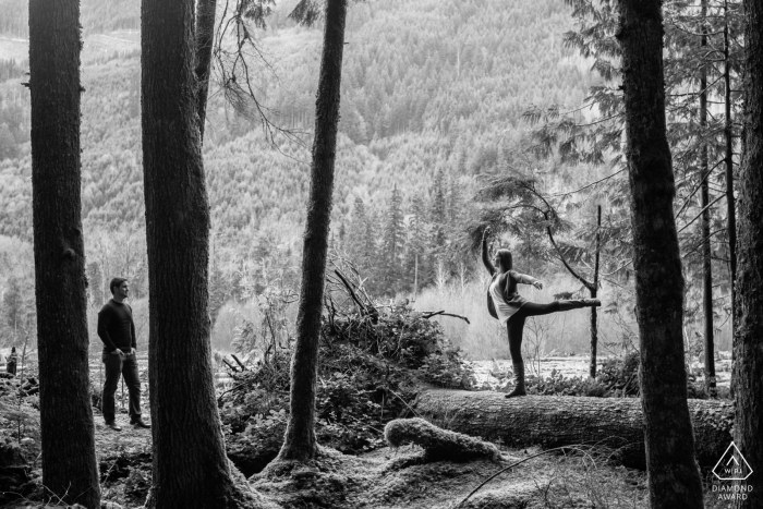 Photo by: <a href="https://www.wpja.com/photos/diamond-award-top-wedding-engagement-photographer/2501756">Ron Storer - Auburn Washington Carbonado, WA Pre Wedding Photo Session | A man watches his future wife show off her ballet skills in the mountains
