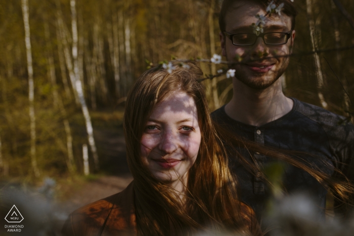 Photo by: <a href="https://www.wpja.com/photos/diamond-award-top-wedding-engagement-photographer/2513716">Rosa Engel - Aachen Nordrhein-Westfalen Engagement Photo Shooting in Aachen with Copule in trees and shadows