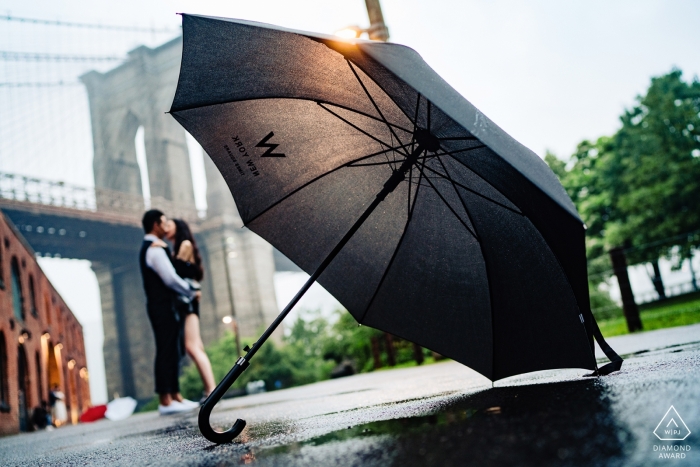 Photo by: <a href="https://www.wpja.com/photos/diamond-award-top-wedding-engagement-photographer/2522911">Wenjie Han - Long Island City New York dumbo nyc portrait session - standing in the rain