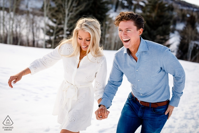Photo by: <a href="https://www.wpja.com/photos/diamond-award-top-wedding-engagement-photographer/2528166">Stacy Gillespie - Silverthorne Colorado Beaver Creek, CO Endless laughter engagement photo session in the snow with fun couple