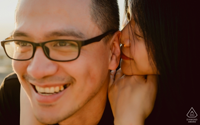 Photo by: <a href="https://www.wpja.com/photos/diamond-award-top-wedding-engagement-photographer/2537986">Lin Yang - Quanzhou Tian'an Park PreWedding Photo - Girl kissing boys ear
