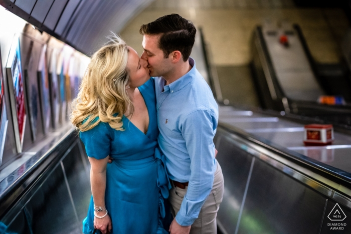 Photo by: <a href="https://www.wpja.com/photos/diamond-award-top-wedding-engagement-photographer/2539191">Paul Tansley - Bordon Hampshire London Underground Escalators - Couple kissing on the escalator during engagement shoot