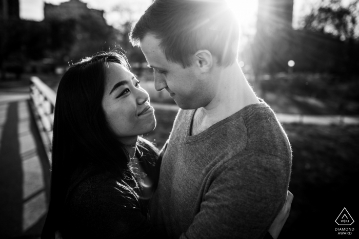 Photo by: <a href="https://www.wpja.com/photos/diamond-award-top-wedding-engagement-photographer/2539551">Allison Williams - Chicago Illinois Couple hugs each other in a ray of sunlight in Chicago's Lincoln Park.