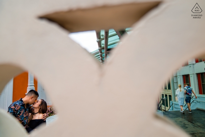 Photo by: <a href="https://www.wpja.com/photos/diamond-award-top-wedding-engagement-photographer/2539641">Vu Nguyen - Ho Chi Minh Singapore Engagement photoshoot with kissing couple and geometric shapes