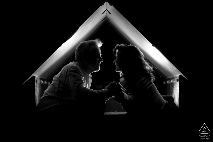 Madrid, Spain Engagement Photographer - A couple smiling inside a kind of tent 