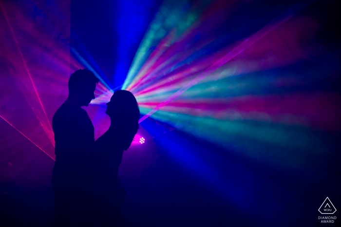 Photo by: <a href="https://www.wpja.com/photos/diamond-award-top-wedding-engagement-photographer/2542855">Tsvetelina Deliyska - Sofia Sofia Veingrad, Bulgaria engagement photography with colorful lights streaming creating a party feel.