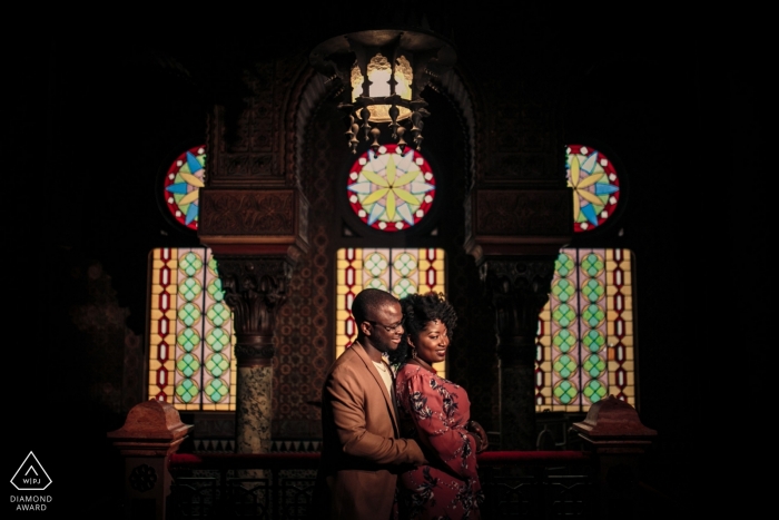 Nigerian couple sitting for engagement session in Lisbon