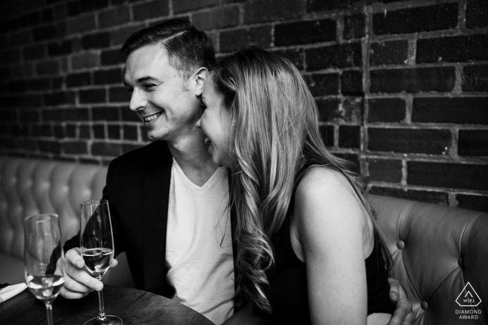 Enjoying a last minute glass of champagne before starting the portraits of their downtown Denver engagement.