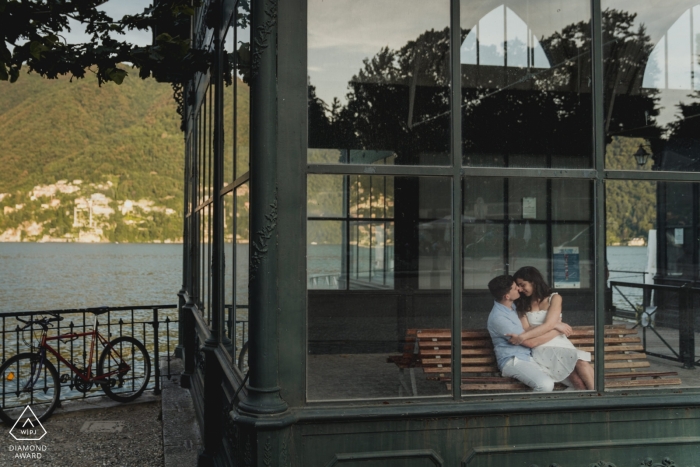 Photo by: <a href="https://www.wpja.com/photos/diamond-award-top-wedding-engagement-photographer/2544056">Federica Ariemma - Napoli Napoli Couple sitting in indoor bench in como lake for pre wedding portraits.