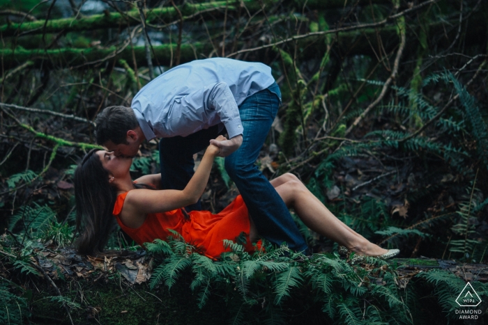 Photo by: <a href="https://www.wpja.com/photos/diamond-award-top-wedding-engagement-photographer/2545182">Ron Storer - Auburn Washington Bonney Lake, WA couple kissing in the forest and having fun during portrait session