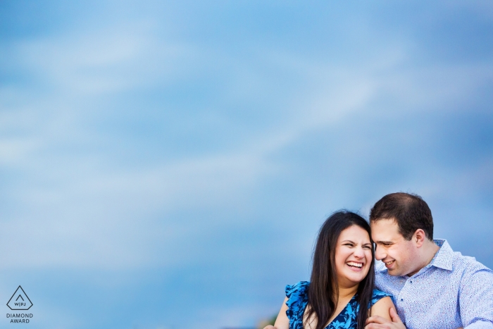 New Jersey engagement session in Hoboken with the bright blue sky over this couple