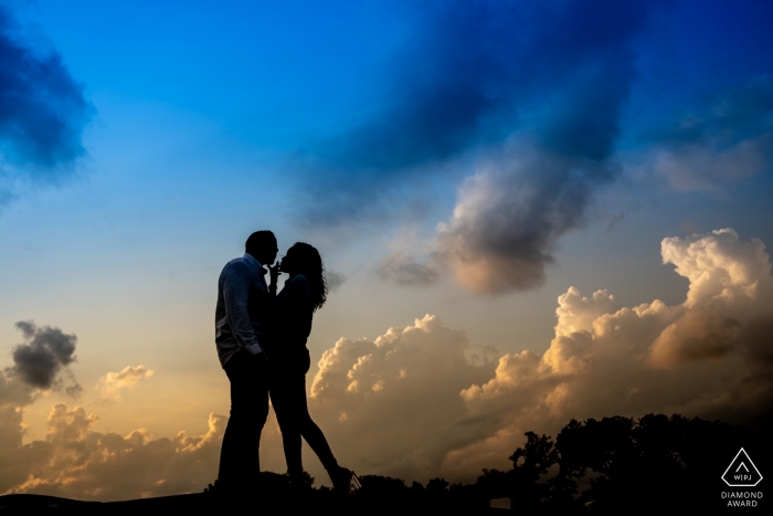  Lincoln memorial Washington DC engagement portrait photographer created silhouette of couple standing on ledge 