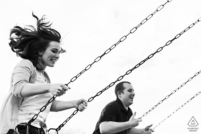 Photo by: <a href="http://www.wpja.com/photos/diamond-award-top-wedding-engagement-photographer/2546884">Sarah V. Martinez - Dover New Hampshire Veasey Memorial Park MA engagement photos - The couple swing during their engagement session in Massachusetts