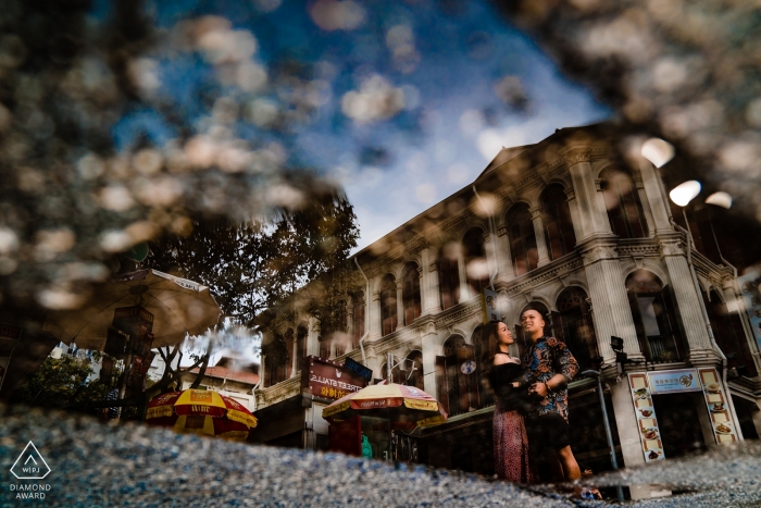Chinatown, Singapore Wedding and Engagement Photo with a reflection in water on the streets Chinatown, Singapore Wedding and Engagement Photographer -- I love so much at reflection, so this shot took me 15 mins to finish.
