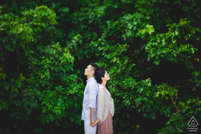 Photo by: <a href="https://www.wpja.com/photos/diamond-award-top-wedding-engagement-photographer/2547219">Qi Xiang - Nanping Engagement Photographer for Nanping - Image contains: couple, trees, green, portrait, holding hands, profiles