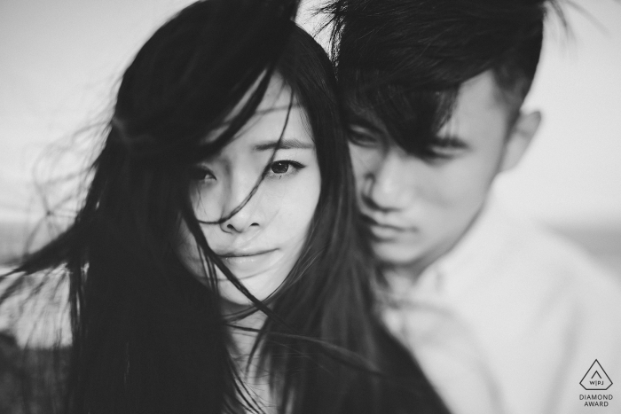 Engagement Photography for Fujian Beach - Image contains: black, white, wind, blowing, couple, portrait