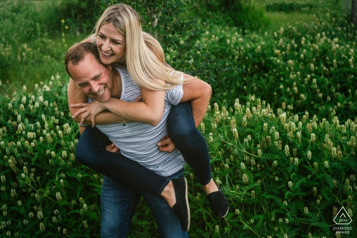 Engagement Photos from River Valley, Edmonton, AB, Canada - Portrait contains: couple, piggyback ride, greenery, fun, engaged