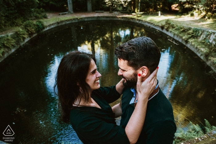 Engagement Portrait from Tibães monastery - Braga - Portugal | Couple holding each other with lake in the background 