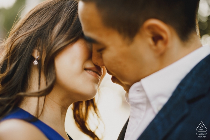 Photo by: <a href="https://www.wpja.com/photos/diamond-award-top-wedding-engagement-photographer/2549615">Ashley Davenport - Castle Dongington Derbyshire Engagement Photos from London - Couple kissing in the London sun