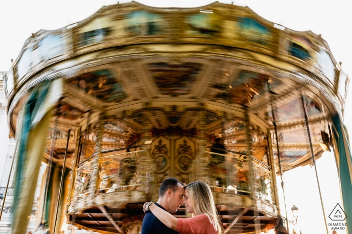 Engagement Photos from Madrid - Couple in front of a carrousel 