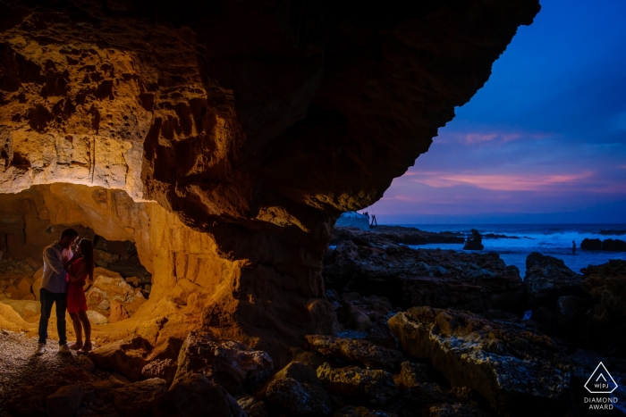 Engagement Photographer for Valencia - Portrait contains: cave, evening sky, beach, couple