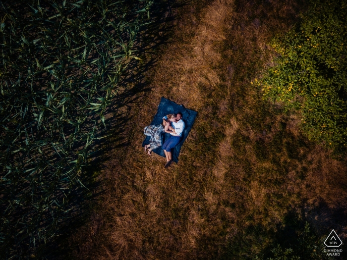 Photo by: <a href="https://www.wpja.com/photos/diamond-award-top-wedding-engagement-photographer/2551515">Anji Martin - Arlington Virginia Engagement Portrait from Kirchhorst, Germany - Session amongst corn fields and apple trees