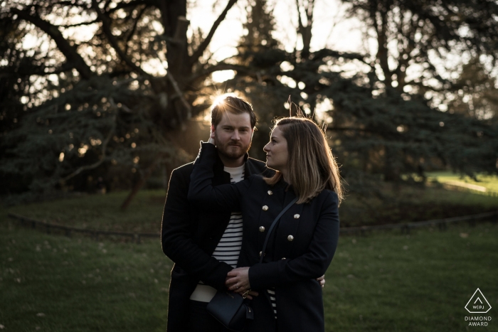 Rennes, France Pre-wedding Image contains: couple, portrait, trees, grass, park Engagement Photographer for Rennes, France - Pre-wedding Image contains: couple, portrait, trees, grass, park
