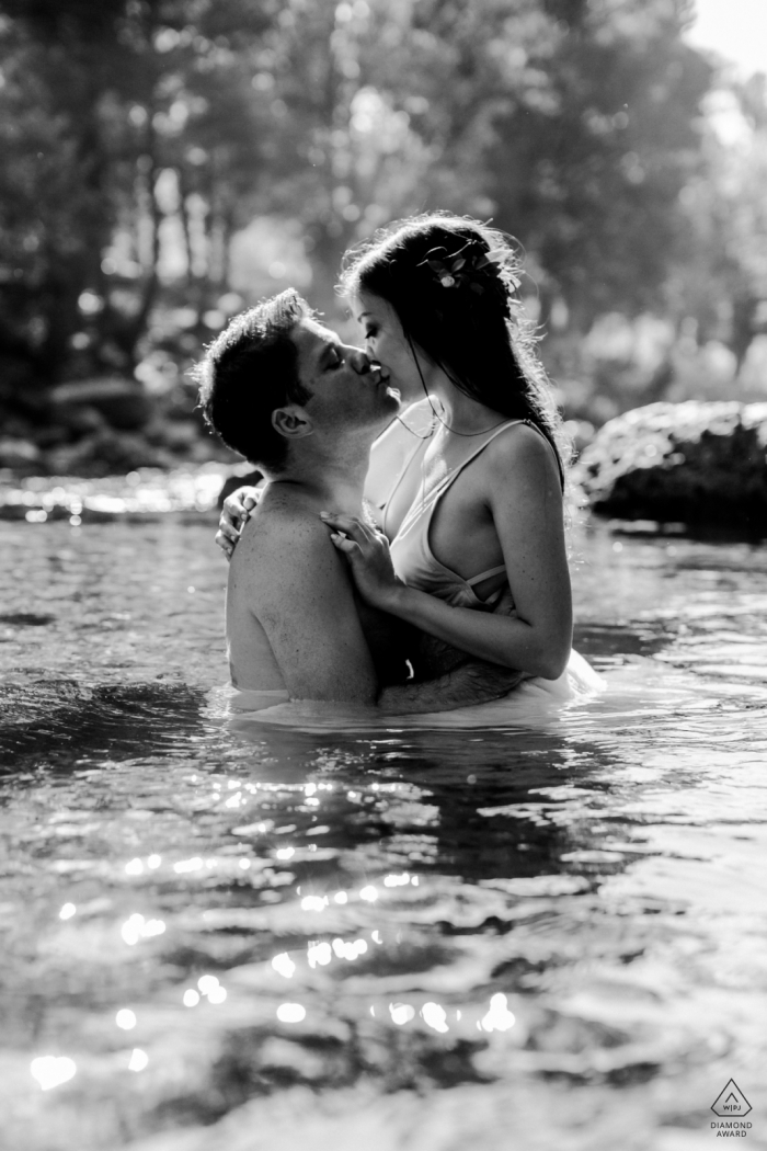 Engagement Photos from Antalya - Portrait contains: black and white, couple, kiss, trees, lake